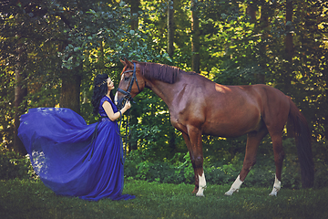 Image showing beautiful girl in dress with horse