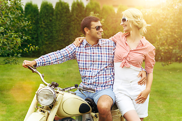 Image showing beautiful couple on retro motorbike