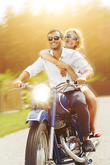 Image showing beautiful couple on retro motorbike