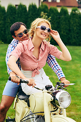 Image showing beautiful couple on retro motorbike