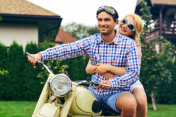 Image showing beautiful couple on retro motorbike