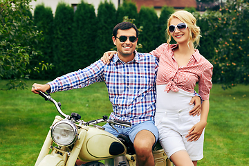 Image showing beautiful couple on retro motorbike