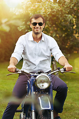 Image showing handsome man on retro motorbike