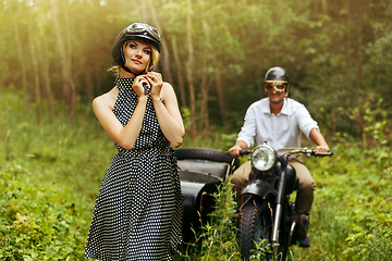 Image showing beautiful couple on retro motorbike