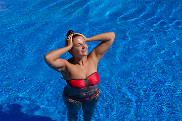 Image showing beautiful woman in swimming pool