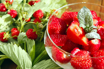 Image showing strawberries in a bowl and strawberries bunches