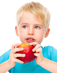 Image showing Portrait of a cute little boy with red apple