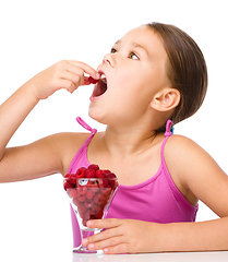 Image showing Little girl with raspberries