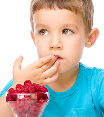 Image showing Little boy with raspberries