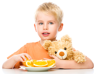 Image showing Portrait of a little boy with his teddy bear