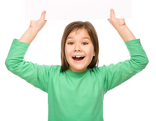 Image showing Little girl is holding a blank banner