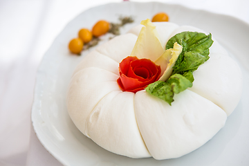Image showing Mozzarella with tomatos and basil leaves