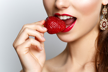 Image showing beautiful girl with fresh strawberries