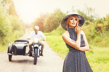 Image showing beautiful couple on retro motorbike