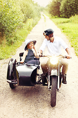 Image showing beautiful couple on retro motorbike