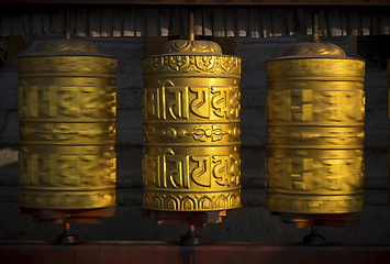 Image showing Rotating buddhist prayer wheels as symbol of buddhism religion