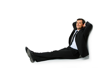 Image showing handsome businessman in suit resting