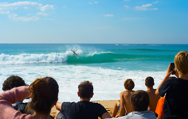 Image showing People watching surfing contest beach