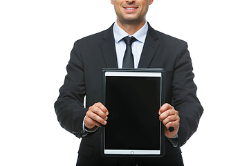 Image showing handsome businessman in suit with tablet