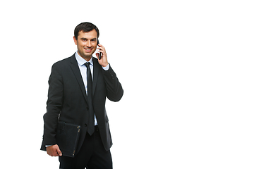 Image showing handsome businessman in suit talking on phone