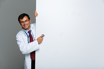 Image showing doctor in white robe with stethoscope