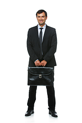 Image showing handsome businessman in suit with briefcase