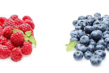 Image showing blueberry and raspberry berries isolated on white background