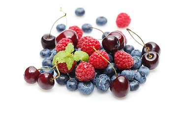 Image showing blueberry, cherry and raspberry berries isolated on white background