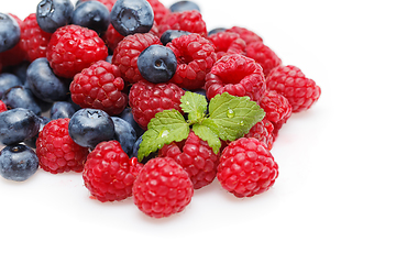 Image showing blueberry and raspberry berries isolated on white background