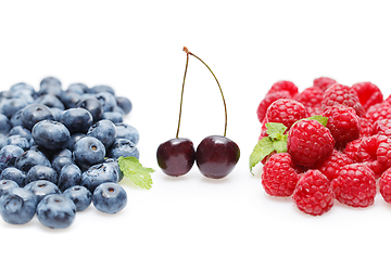 Image showing blueberry, cherry and raspberry berries isolated on white background