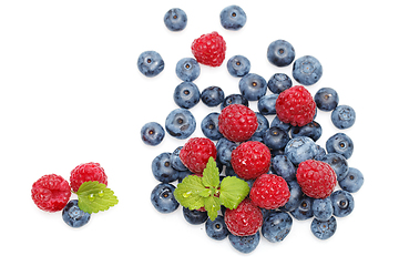 Image showing blueberry and raspberry berries isolated on white background