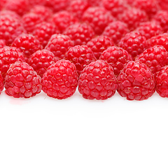 Image showing many raspberry berries isolated on white