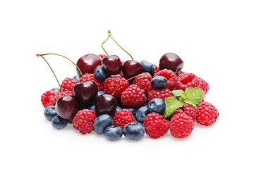 Image showing blueberry, cherry and raspberry berries isolated on white background