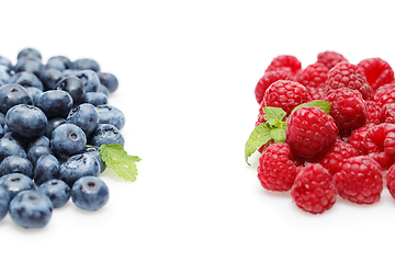 Image showing blueberry and raspberry berries isolated on white background