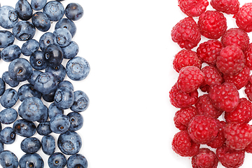 Image showing blueberry and raspberry berries isolated on white background