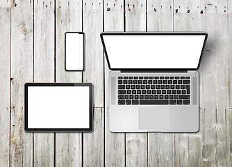 Image showing Laptop, tablet and phone set mockup on a wooden background. 3D r