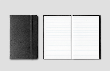 Image showing Black closed and open notebooks isolated on grey