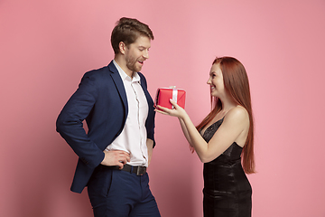 Image showing Valentine\'s day celebration, happy caucasian couple isolated on coral background