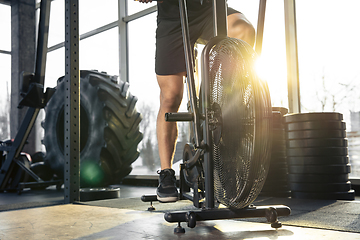 Image showing The male athlete training hard in the gym. Fitness and healthy life concept.