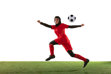 Image showing Arabian female soccer or football player isolated on white studio background