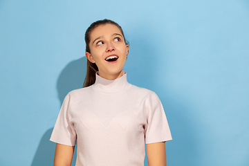 Image showing Caucasian teen girl portrait isolated on blue studio background