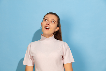 Image showing Caucasian teen girl portrait isolated on blue studio background