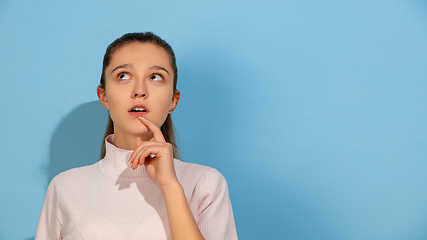 Image showing Caucasian teen girl portrait isolated on blue studio background