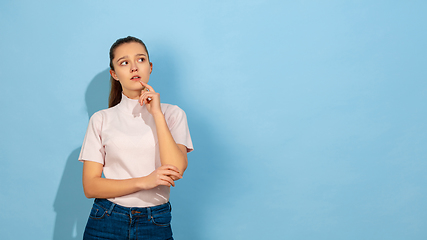 Image showing Caucasian teen girl portrait isolated on blue studio background