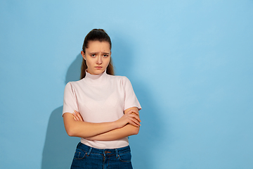 Image showing Caucasian teen girl portrait isolated on blue studio background