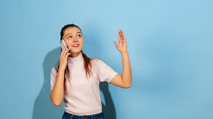 Image showing Caucasian teen girl portrait isolated on blue studio background