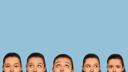 Image showing Caucasian teen girl portrait isolated on blue studio background