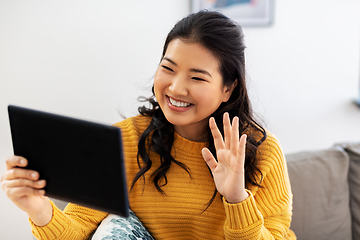 Image showing woman with tablet pc having video call at home