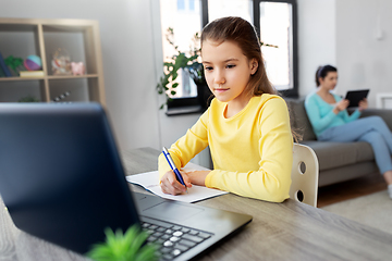 Image showing student girl with laptop learning online at home