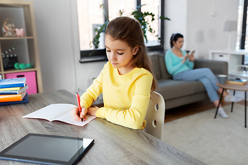 Image showing student girl with tablet pc learning at home